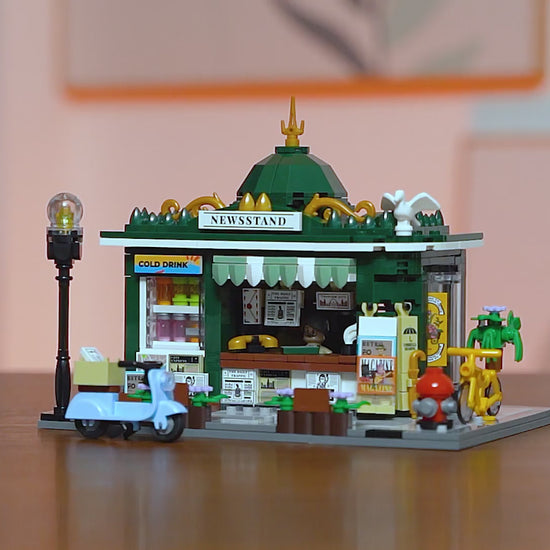 Unboxing und Detailansicht des Funwhole Newsstand Zeitungskiosk F9023 Klemmbausteine-Sets mit Beleuchtung.