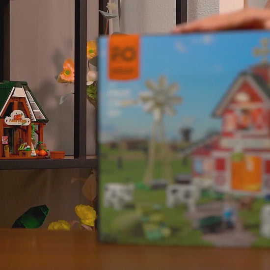 Unboxing und Detailansicht des Funwhole The Cow Barn Farm Bauernhof F9037 Klemmbausteine-Sets mit Beleuchtung.